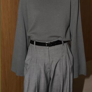 Marcela London Padded Shoulder Mock Neck Knit top in Charcoal. One Size.